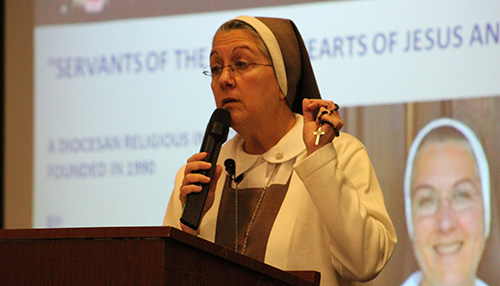 Mother Adela Galindo, foundress of the Servants of the Pierced Hearts of Jesus and Mary, leads a prayer before speaking at the Respect Life luncheon.