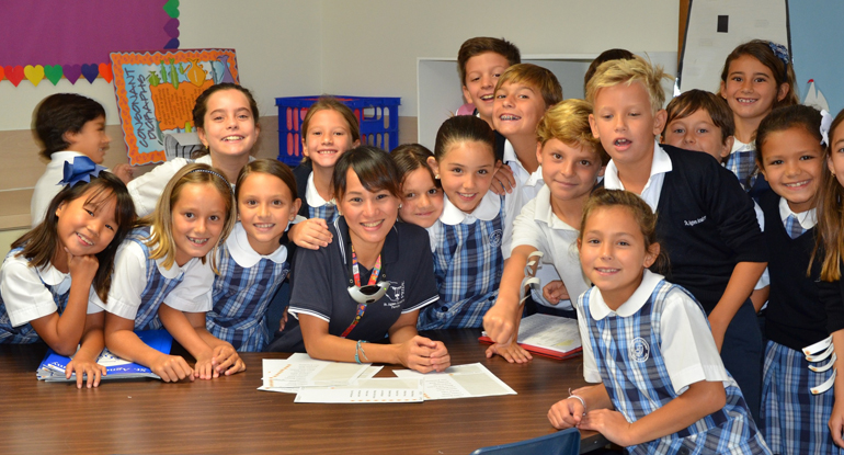 Third grade students at St. Agnes Academy can't wait to learn from their teacher Joanna Lopez (center) as they all embark on a new academic year.