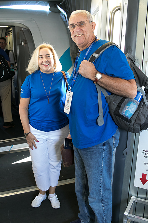 Andy Gomez and his wife, Frances Serantes Gomez, prepare to board the charter flight for Havana.