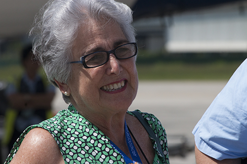 Gloria Arazoza smiles after setting foot in the homeland she left 55 years ago.