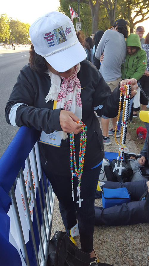 Rosa Vargas sorts through rosaries that she brought to distribute to pilgrims that came to support Pope Francis. Vargas was one of among 46 pilgrims that travelled from the Archdiocese of Miami to see and support Pope Francis in Washington, D.C.