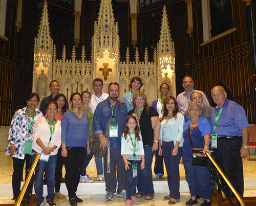 The official pilgrimage group to the weekend festivities at the World Meeting of Families pose for a photo at St. John the Evangelist Church in Philadelphia before the celebration of a Mass for all the pilgrims by Archbishop Thomas Wenski.
