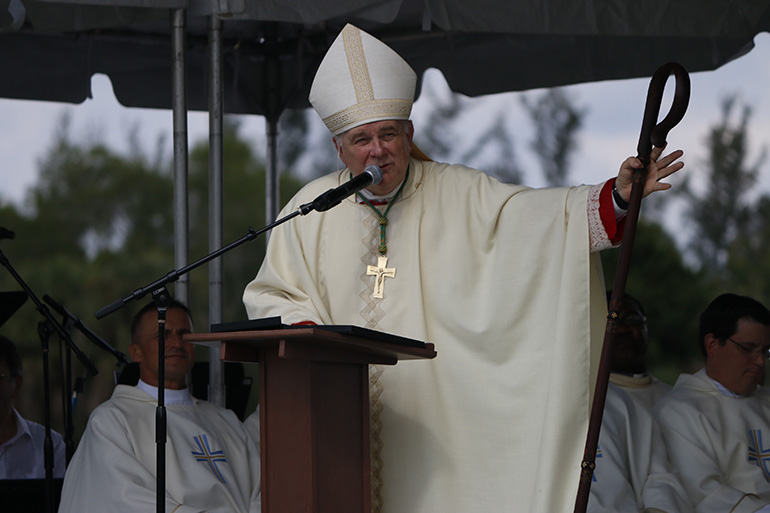 Archbishop Thomas Wenski preaches his homily at the picnic Mass.