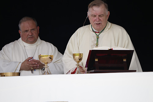 Archbishop Thomas Wenski celebrates the Mass with Auxiliary Bishop Peter Baldacchino beside him.