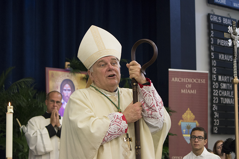 Archbishop Thomas Wenski says some closing remarks to catechists at the conclusion of the conference's opening Mass. Nearly 1,000 catechists gathered Oct. 24 at St. Thomas Aquinas High School in Fort Lauderdale for their annual day-long conference. They honored three of their own with Lifetime Catechetical Leadership awards and the Esperanza Ginoris Award, and also recognized the work of men and women religous during this Year of Consecrated Life. Archbishop Thomas Wenski celebrated the conference's opening Mass.