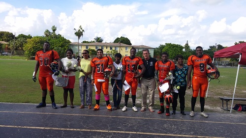 Honored for their commitment to the team, the following students are pictured with their mother and ACND Athletic Director and Coach Greg Magner. From left: James Ney Joseph, Sam Kattura, Marc Raymond, Aaron Ashe and Leopold Evariste.