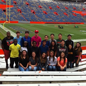 The Pace High students pose for a photo inside the University of Florida's Ben Hill Griffin Stadium as part of their six-university trip through Florida.