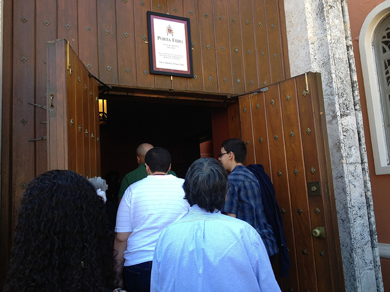 People enter St. Mary Cathedral's Holy Door during the Year of Faith in 2013. That same door will soon be re-opened for the Year of Mercy.