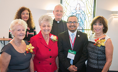 The 2015 catechetical awards recipients pose in the chapel of St. Thomas Aquinas High School. From left: Rose Young, Esperanza Ginoris Award winner;  Adrian Dominican Sister Joan Leo Kehn of St. Gregory Parish and Vilma Angulo, winners of the Lifetime Catechetical Leadership Award; back row: Kim Pryzbylski, senior director of Faith Formation for the archdiocese; Msgr. Vincent Kelly, supervising principal of St. Thomas Aquinas High; and Peter Ductram, director of the Office of Catechesis.