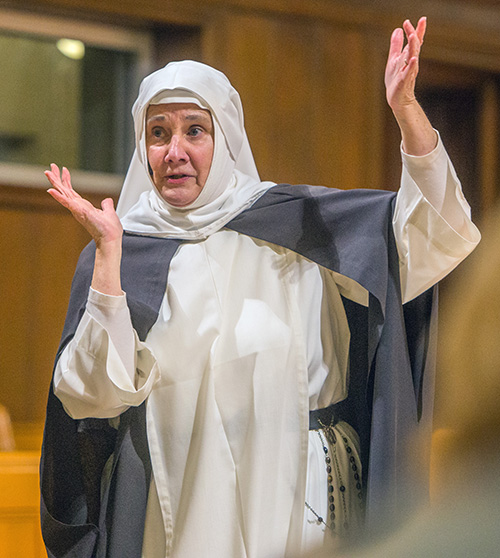 Using simple props and imagination, Dominican Sister Nancy Murray portrays St. Catherine of Siena, patroness of the Dominican order of women religious, in a solo performance at Barry University's Cor Gesu Chapel.