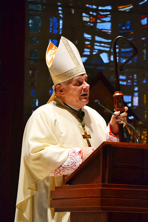 Archbishop Thomas Wenski preaches the homily.