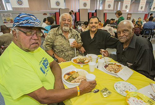 Chef Rafael Garcia (third from left) joins St. Elizabeth Gardens residents Richard McRay, Ed Ventura and Charlie Lovett for a photo.