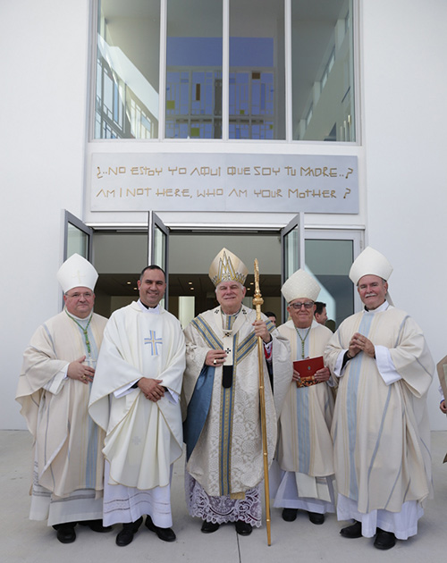 Bishops who took part in the dedication Mass for Our Lady of Guadalupe stand with the church's pastor, Father Israel Mago (second from left) after the Mass. From left: Auxiliary Bishop Peter Baldacchino, Archbishop Thomas Wenski, Archbishop Emeritus John C. Favalora and Bishop Emeritus Fernando Isern of Pueblo, Colorado.
