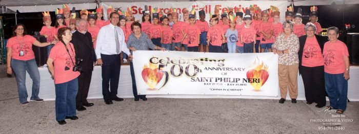 Students of St. Jerome School, Fort Lauderdale, celebrate the 500th anniversary of St. Philip Neri's birth. Standing next to Father Curtis Kiddy, at the left, is Mayor Jack Seiler of Fort Lauderdale.