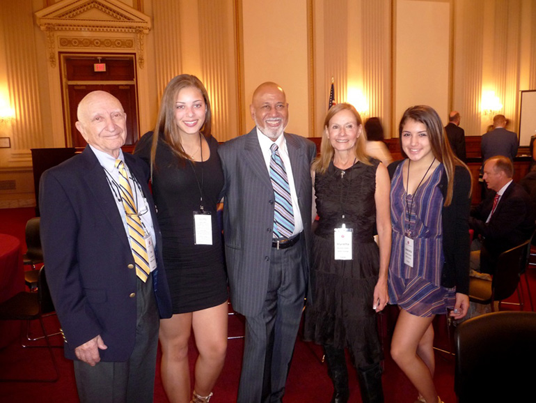Bella's Kinship Group, created by Chaminade-Madonna College Preparatory students Isabella (center left) and Gabriella (far right) and their family, was recognized by the Congressional Coalition on Adoption Institute as 2015 Angels in Adoption. The non-profit serves as a support and social group for children being raised by their grandparents or other familial guardian. In the photo are (from left to right) Dr. Ira Glazer, Isabella Glazer, U.S. Representative Alcee Hastings, Dr. Marietta Glazer and Gabriella Glazer.