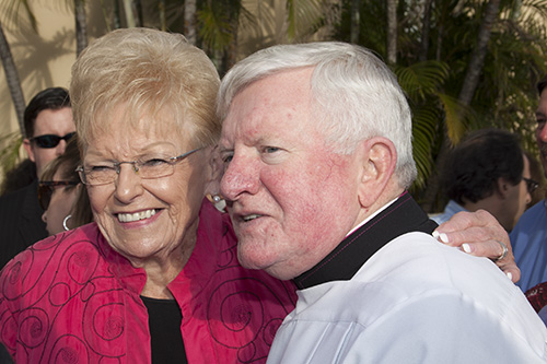 Msgr. Edmond Whyte accepts congratulations from St. Mark parishioner Helen Long after the ceremony where he received the honorary title of Prelate to His Holiness (monsignor), back in March 2013.