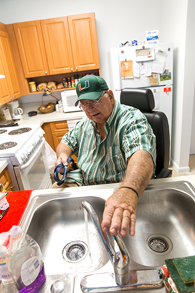 Edward Tobey, a new resident at St. Joseph Manor Independent Living Facility in Pompano Beach, shows the handicapped-friendly features in his apartment.