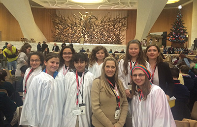 Members of St. David's choir pose for a photo inside the Paul VI Audience Hall.
