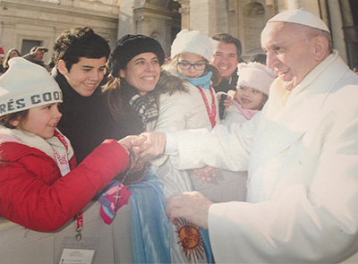 The Vivot family from St. Bonaventure Parish in Davie greets Pope Francis during a general audience outside St. Peter's Basilica.