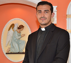 Father Ivan Rodriguez in the chapel at St. John the Apostle Church, Hialeah.