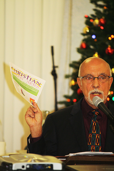 Christian Action News publisher Edward Daccarett encourages guests at the Mary for Life banquet to become informed about life issues by signing up for a free subscription to his publication.