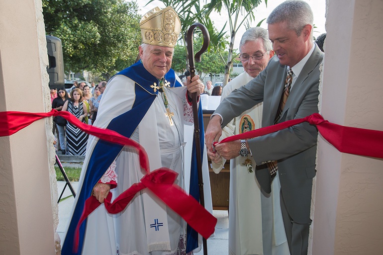 Archbishop Thomas Wenski, Father Michael Greer, Assumption's pastor, and Lauderdale-By-The-Sea Mayor Scot Sasser cut the ribbon to officially open the new building.