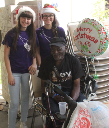 Students from the Purple Heart Club at Immaculata-La Salle High shared some Christmas cheer with  military veterans during their visit to the VA Hospital.