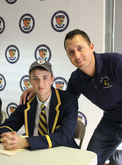 Daniel Brennan, headed to the University of Pennsylvania, poses with Belen's head crew coach, Yunian Cabrera.