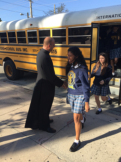 Father Christopher Marino, rector of St. Mary Cathedral, welcomes Sts. Peter and Paul students to the "mother church" of the Archdiocese of Miami.
