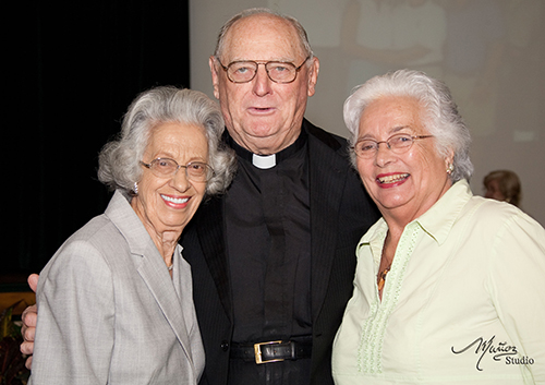 Msgr. Noel Fogarty poses after his retirement Mass in 2011 with Ann Schandelmayer and Connie Sessions, who have been parishioners at St. Gregory since the 1960s.