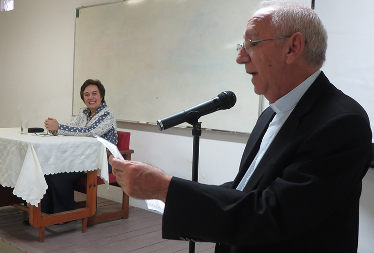 Bishop Emilio Aranguren, of Holguin, Cuba, introduces Maite Uribe, president of the Teresian Association.