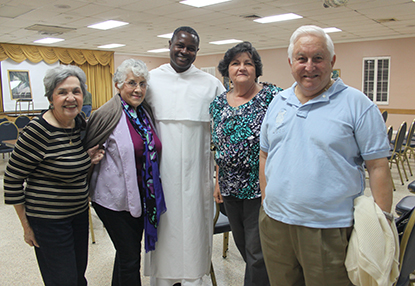 Some of those in attendance at the conference on St. Dominic were St. Dominic parishioners posing here with their pastor, from left: Teresita Heredia, Eulalia Figueroa, Dominican Father Eduardo Logiste Félix, Maritza Álvarez and Clemente Heredia.