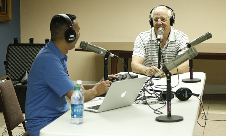 The Catholic Guy on SiriusXM Radio, Lino Rulli, speaks with longtime listener Wayne Cree, right, who drove in from St. Petersburg, during his March 1 broadcast from the archdiocesan Pastoral Center in Miami.