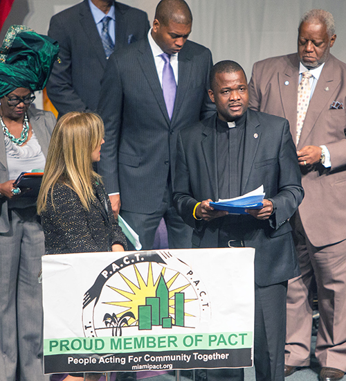 Msgr. Chanel Jeanty, president of PACT and pastor of St. James Church, addresses the PACT assembly.