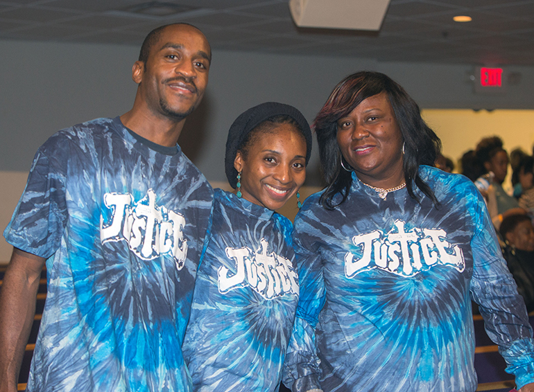 Evan Allen, Terrica Allen and Sharon Henley of St. Peter Missionary Baptist Church proudly show their "Justice" T-shirts at PACT's Nehemiah assembly.