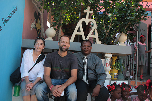 From left, Teresita Gonzalez of Amor en Accion, and Andres Novela of Msgr. Edward Pace High School, pose with the principal of the Our Lady of the Lakes' sister school in Nan Palan.