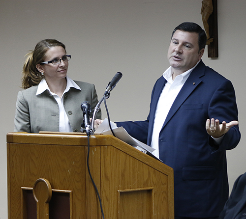 Kari and Stephen Colella speak about The Joy of Love (Amoris Laetitia) as Archbishop Thomas Wenski listens. The couple, married 19 years, are heading up a task force that will recommend ways to improve marriage preparation programs in the archdiocese.