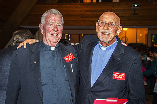 Father Thomas O’Dwyer, pastor of Little Flower Church in Hollywood, poses with Father Roger Holoubek, pastor of St. Maurice at Resurrection in Dania Beach.