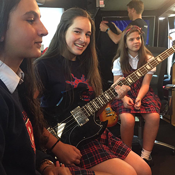 St. Brendan School choir members  Ariana Nunez, Crystal Padron, and Giselle Castaneda spent all day in the "peace bus" recording studio. They wrote a song, recorded it, and made a video which is still being edited.