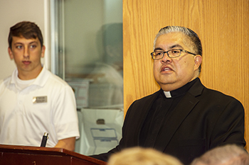 Msgr. Roberto Garza, St. Vianney Seminary rector, speaks at the start of the event.