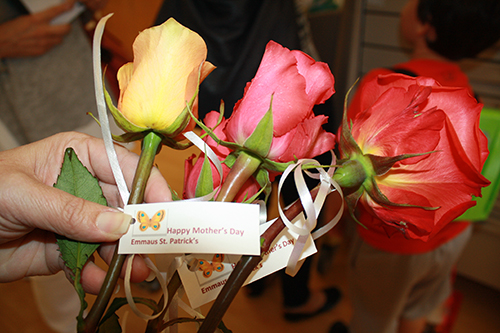 Each of the more than 600 roses distributed to the ladies at the nursing homes the week of Mother's Day were lovingly prepared with a greeting and a ribbon by women of St. Patrick's Emmaus group. They took special care to remove all the thorns.