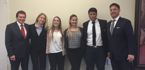 St. Brendan High's Law Club students pose with their law instructor, Steven Piscitelli, far left, and attorney Scott Rembold. The students are, from left, Alexandra Ibarria, Katherine Pastor, Elizabeth Morejon and Raul Moldes.