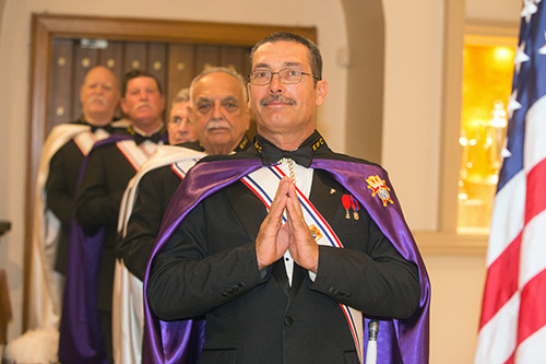 Phil Williams, Knights of Columbus Assembly 2723, and other members of the color corps pray during Mass.