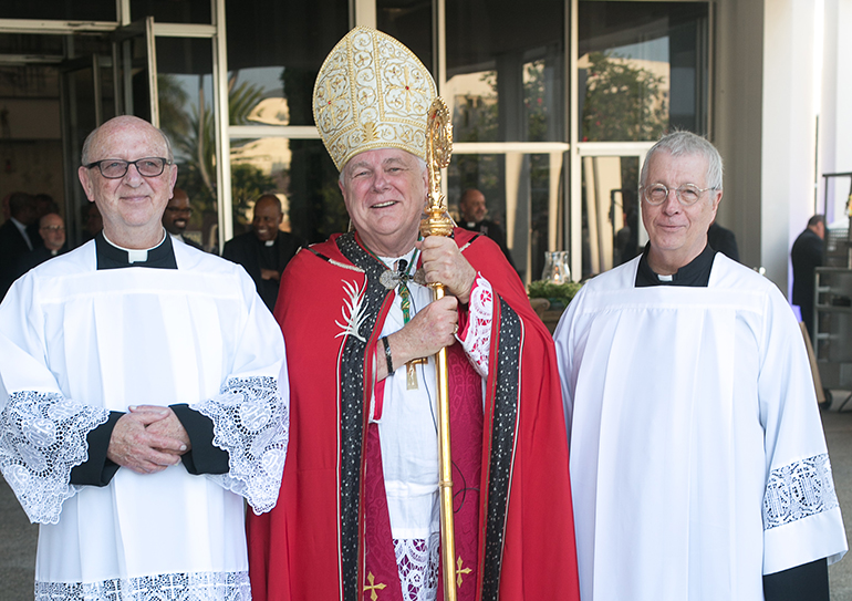 Miami Archbishop Thomas Wenski poses outside St. Raphael Chapel with the two other priests who were ordained with him 40 years ago: Father Daniel Kubala, left, pastor of St. Matthew in Hallandale, and Father Thomas Wisniewski, pastor of Mary Help of Christians in Parkland. A fourth classmate, Father Richard Soulliere, could not make the celebration because at his age, 93, he does not like to drive at night.