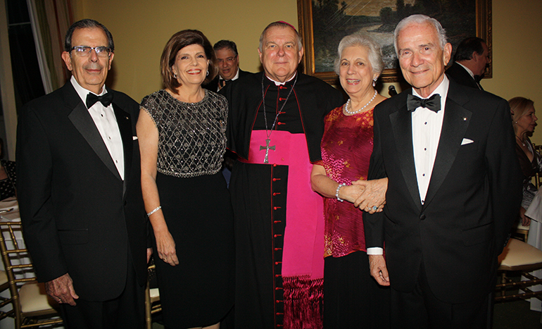 Archbishop Thomas Wenski, chief chaplain of the Cuban Association of the Order of Malta, poses with, from left,  President Juan Jose Calvo and his wife, Valentina Calvo, and Fernando Garcia Chacon, president emeritus, and his wife, Margarita García Chacon.