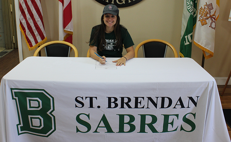 St. Brendan High School senior Lil Padro signs her National Letter of Intent to play basketball for the Bethel College Threshers, located in North Newton, Kansas.