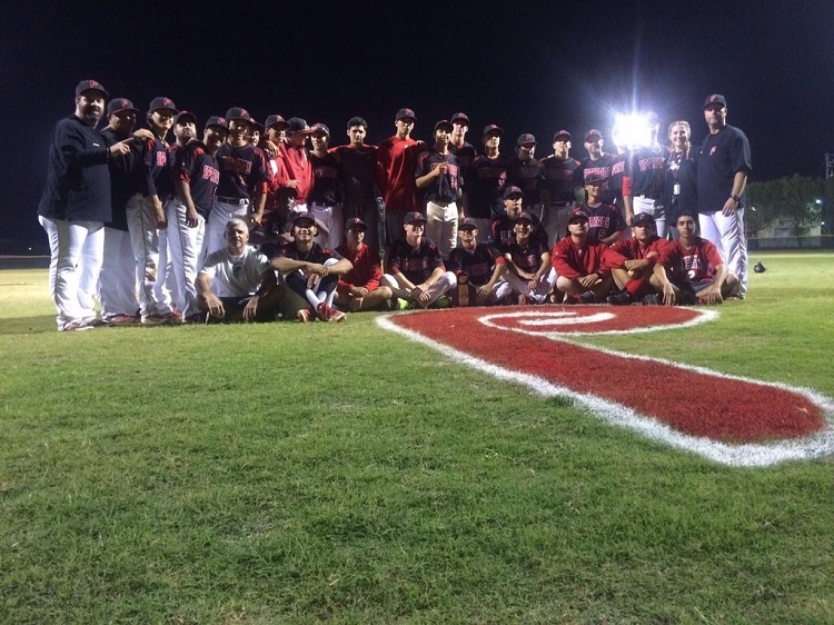 Msgr. Edward Pace High School's varsity baseball team members pose with their district championship trophy following their 5-4 victory over Mater Lakes Academy April 20.