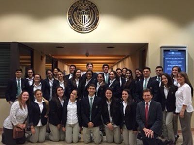 St. Brendan High Law and Global Business Academy students pose for a group photo at the Federal Reserve in Doral.