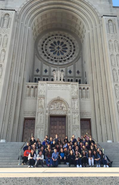 St. Brendan High STEM and Medical Sciences students pose for a group photo in front of the doors of the Basilica of the National Shrine of the Immaculate Conception in Washington, DC.