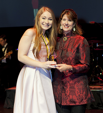 Carbonell Award-winning actress Patti Gardner presents Archbishop McCarthy High's Bella Miulescu with the award for Supporting Actress in a Play for her work on "The Crucible."